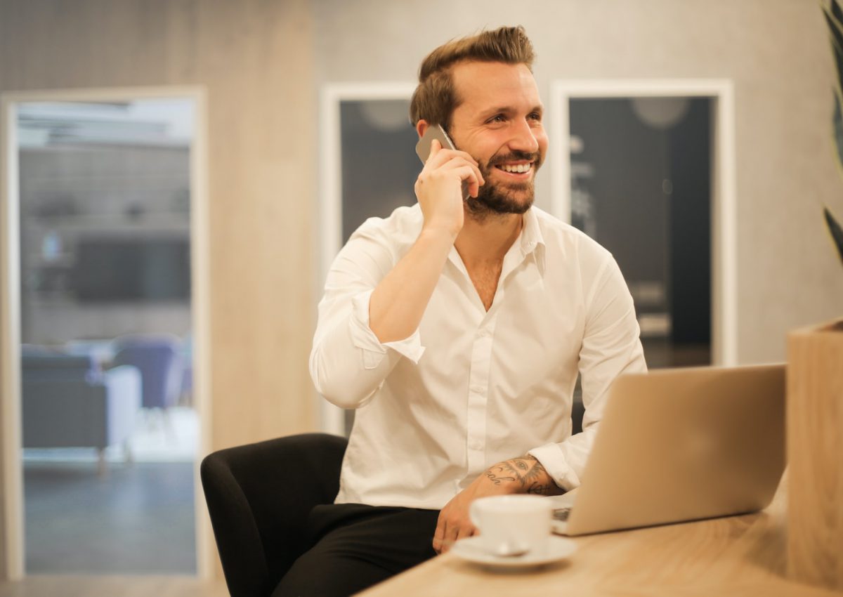 man using smartphone on chair