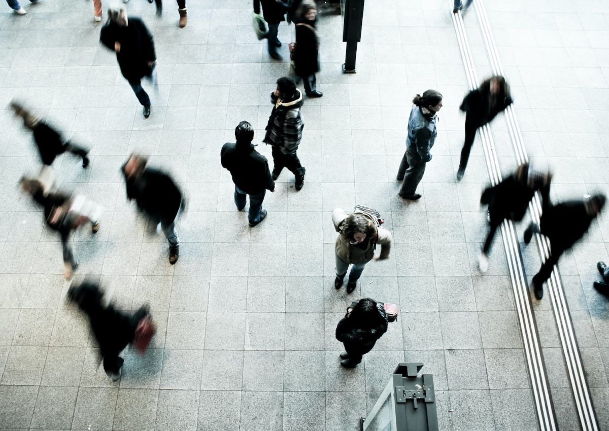 people walking on grey concrete floor during daytime